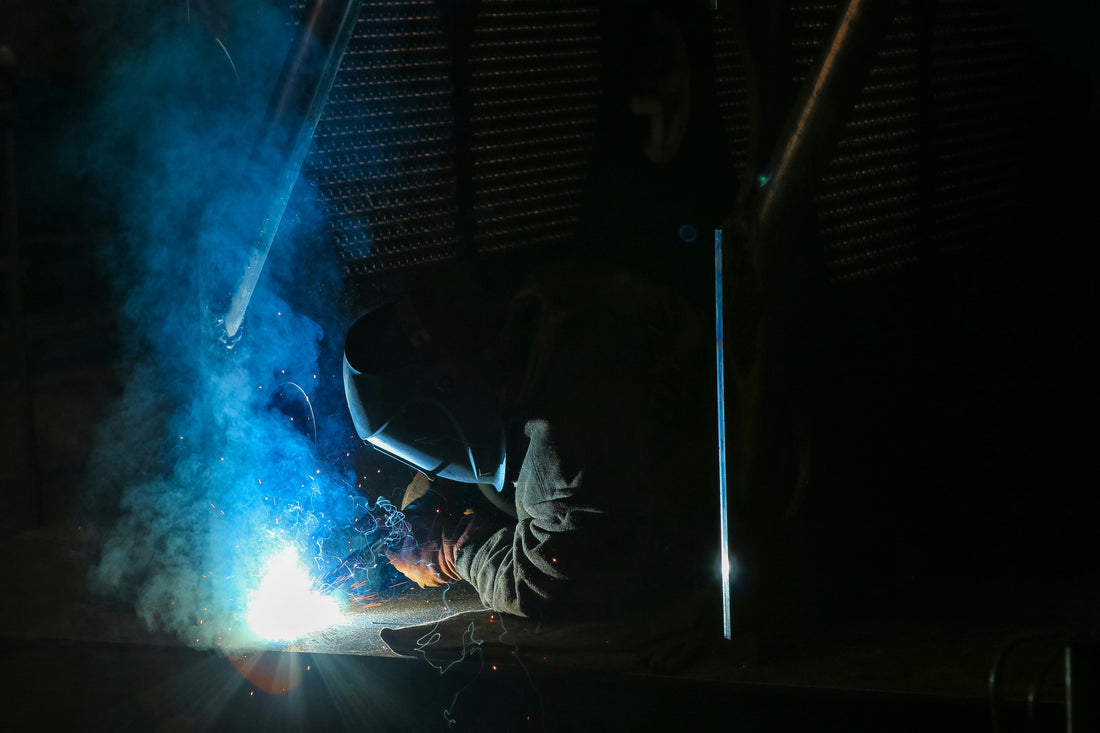 Man wearing safety gloves while hard at work.